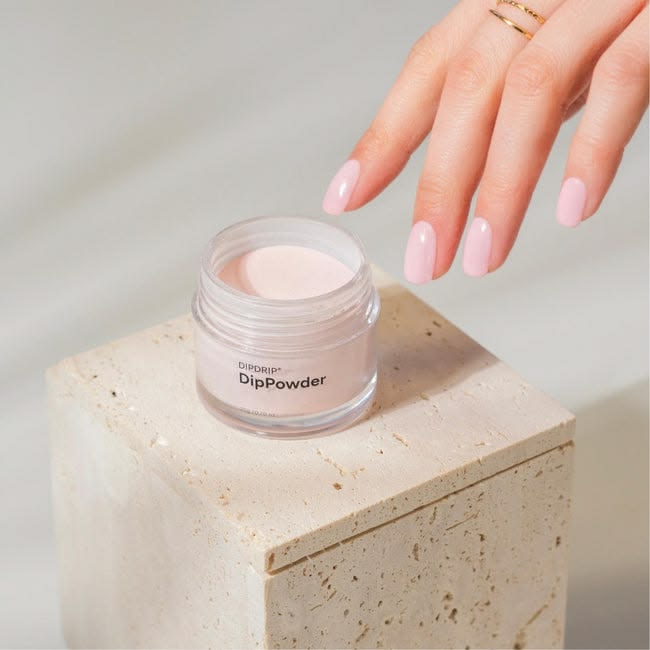 Dipping powder nail product with pink manicure